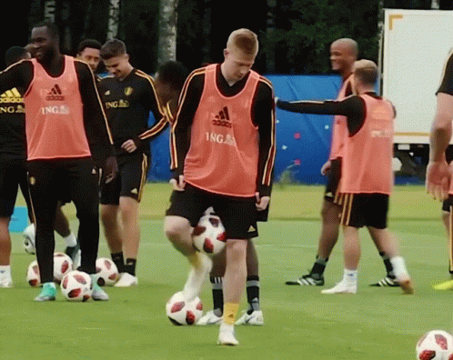 A Group Of Soccer Players Wearing Ing Jerseys GIF