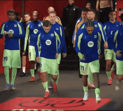 A Group Of Soccer Players Wearing Neon Green And Blue Jerseys With Spotify Logos On Them GIF