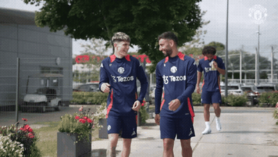 A Group Of Soccer Players Wearing Tezos Jerseys GIF