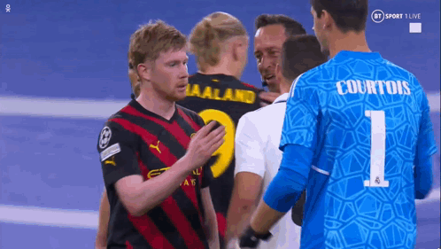 A Group Of Soccer Players With One Wearing A Number 1 Jersey GIF
