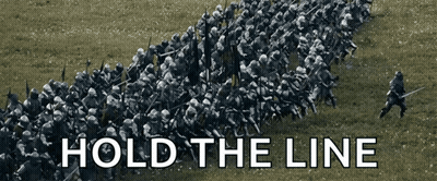 A Group Of Soldiers Are Lined Up In A Field With The Words Hold The Line Above Them GIF