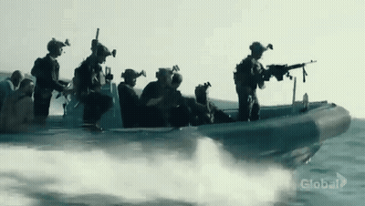 A Group Of Soldiers Are Riding In A Boat In The Ocean With Global Written On The Bottom GIF