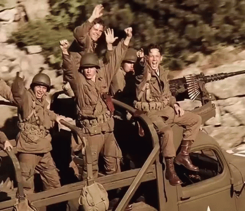 A Group Of Soldiers Are Riding In The Back Of A Vehicle GIF