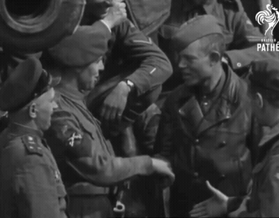 A Group Of Soldiers Are Shaking Hands And The Word Pathe Is On The Bottom GIF