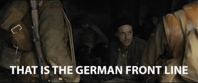 A Group Of Soldiers Are Sitting In A Dark Room With The Words That Is The German Front Line Above Them GIF