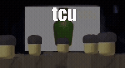 A Group Of Soldiers Are Sitting In Front Of A Screen With A Green Bottle In The Background . GIF