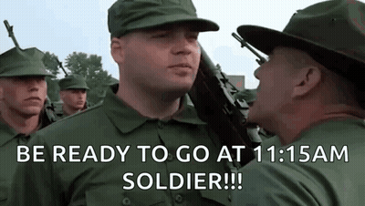 A Group Of Soldiers Are Standing In A Line And One Of Them Is Holding A Gun And Says Be Ready To Go GIF