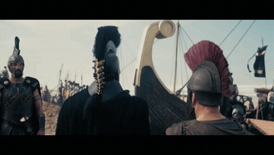 A Group Of Soldiers Are Standing In Front Of A Boat With A Banner That Says ' Rvs ' On It GIF