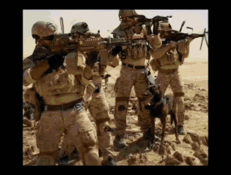 A Group Of Soldiers Are Standing In The Desert With Guns GIF