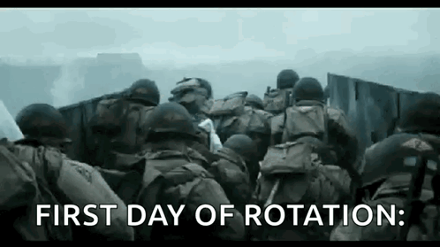 A Group Of Soldiers Are Standing Next To Each Other In Front Of A Wall In A Battle Scene . GIF