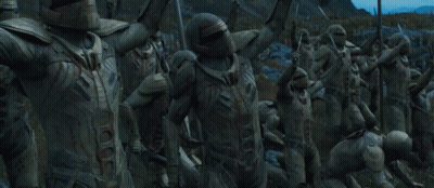 A Group Of Soldiers Holding Flags And Swords GIF