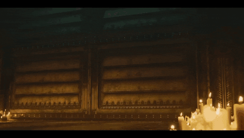 A Group Of Soldiers Standing In A Dark Room With Candles GIF
