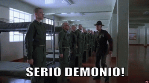 A Group Of Soldiers Standing In A Hallway With The Words Serio Demonio Written On The Bottom GIF