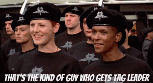 A Group Of Soldiers Standing In A Line With A Caption That Says That 'S The Kind Of Guy Who Gets Tag Leader GIF