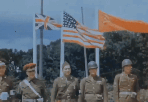 A Group Of Soldiers Standing In Front Of Flags Including The American Flag GIF