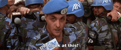 A Group Of Soldiers Wearing Blue Helmets With An On Them GIF
