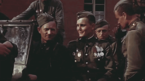 A Group Of Soldiers With Medals On Their Uniforms Including One With The Number 6 On It GIF