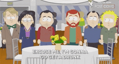 A Group Of South Park Characters Are Standing Around A Table With A Vase Of Flowers On It . GIF