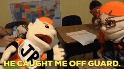 A Group Of Stuffed Animals Are Sitting At Desks In A Classroom With The Words He Caught Me Off Guard . GIF