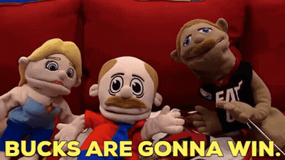 A Group Of Stuffed Animals Are Sitting On A Red Couch With The Words Bucks Are Gonna Win GIF