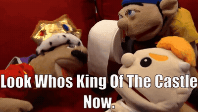 A Group Of Stuffed Animals With The Words Look Whos King Of The Castle Now Below Them GIF