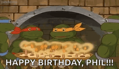 A Group Of Teenage Mutant Ninja Turtles Are Celebrating Their Birthday With A Pizza . GIF