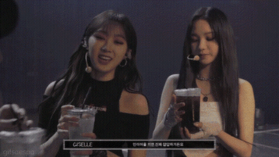 a group of three women holding drinks with t.m.i written on the bottom