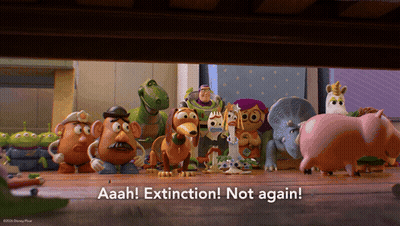 A Group Of Toy Story Characters Are Standing On A Wooden Floor With The Words Aaah Extinction Not Again GIF