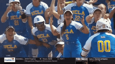 A Group Of Ucla Softball Players Celebrate A Win GIF