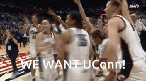A Group Of Uconn Basketball Players Are Celebrating A Win GIF