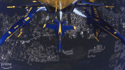 A Group Of Us Navy Planes Flying In Formation GIF