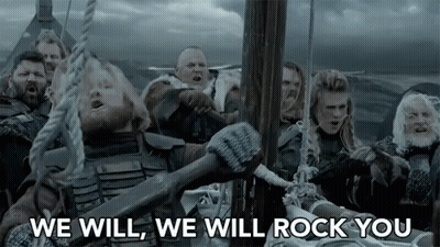 A Group Of Vikings Are On A Boat In The Ocean And One Of Them Is Holding A Large Axe . GIF