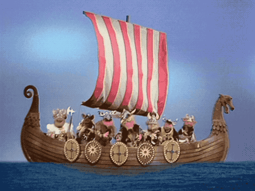 A Group Of Vikings On A Boat With A Red White And Blue Sail GIF