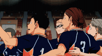 A Group Of Volleyball Players Are Huddled Together And One Of Them Has The Number 3 On The Back Of His Jersey GIF