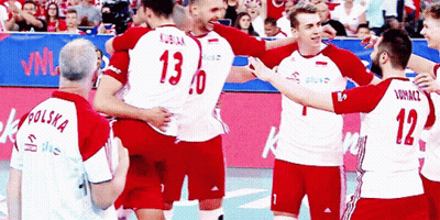 A Group Of Volleyball Players Are Hugging And One Has The Number 13 On His Jersey GIF