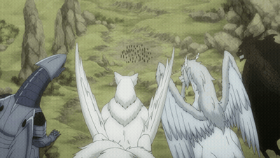 A Group Of White Animals Standing In A Field GIF
