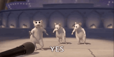A Group Of White Mice Are Dancing In Front Of A Microphone And Saying Yes . GIF