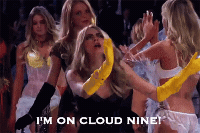 A Group Of Women Are Dancing And One Of Them Is Wearing A Yellow Glove . GIF