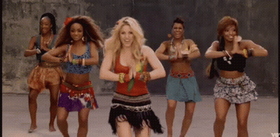 A Group Of Women Are Dancing In A Line With One Woman Wearing A Red Top . GIF