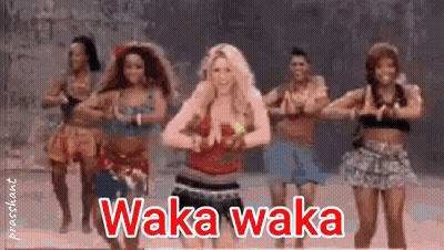A Group Of Women Are Dancing In A Line With The Words Waka Waka Written Above Them GIF