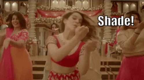 A Group Of Women Are Dancing In A Room With The Words `` Shade '' Written On The Bottom . GIF