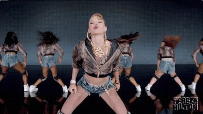 A Group Of Women Are Dancing In Front Of A Screen That Says ' Freak Hilton ' On It GIF