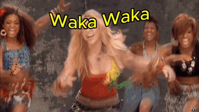 A Group Of Women Are Dancing In Front Of A Sign That Says ' Waka Waka ' GIF
