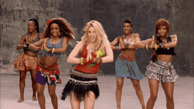 A Group Of Women Are Dancing Together And One Of Them Is Wearing A Red Top GIF