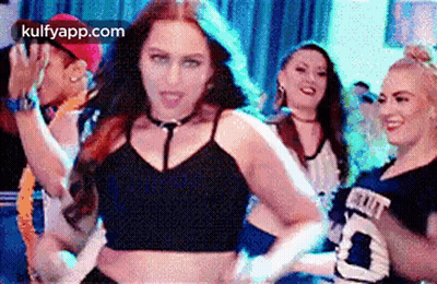 A Group Of Women Are Dancing Together At A Party In A Club . GIF