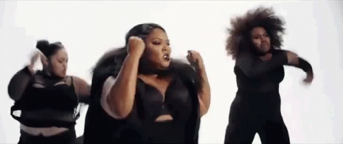 A Group Of Women Are Dancing Together On A White Background In A Video . GIF