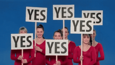 A Group Of Women Are Holding Signs That Say No On Them GIF