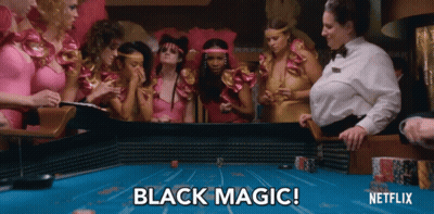 A Group Of Women Are Playing A Game Of Poker And The Words Black Magic Are Visible GIF