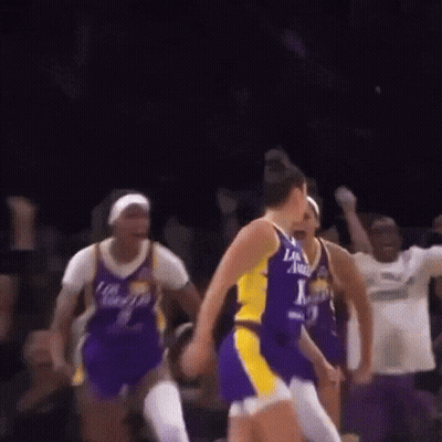 A Group Of Women Are Playing Basketball And One Of Them Is Wearing A Jersey That Says Los Angeles GIF