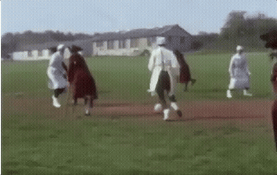 A Group Of Women Are Playing Soccer On A Field . GIF